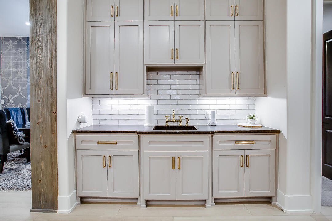 4821 119th Place Lubbock, TX 79424 - Photo 19 of 77 a kitchen with granite countertop white cabinets and sink