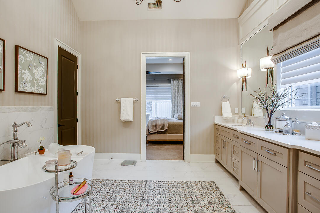 4821 119th Place Lubbock, TX 79424 - Photo 29 of 77 a bathroom with a sink a toilet and shower