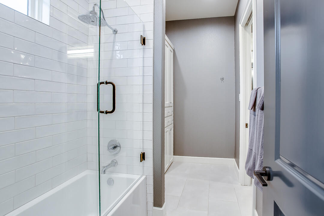 4821 119th Place Lubbock, TX 79424 - Photo 39 of 77 a bathroom with a bathtub and a shower