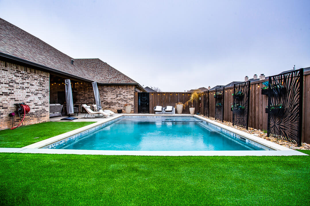 4821 119th Place Lubbock, TX 79424 - Photo 48 of 77 a view of a house with swimming pool and sitting area