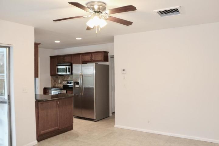9 Burning Tree Lane Boca Raton, FL 33431 - Photo 13 of 26 a kitchen with a refrigerator and a sink