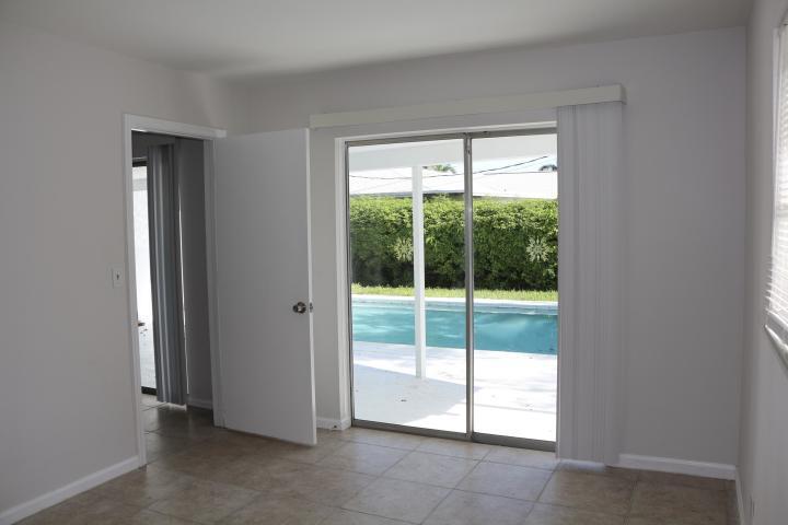9 Burning Tree Lane Boca Raton, FL 33431 - Photo 14 of 26 a view of an empty room with a large window