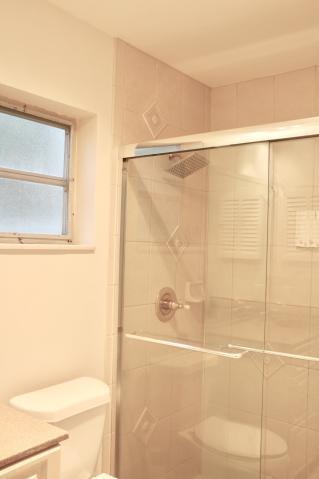 9 Burning Tree Lane Boca Raton, FL 33431 - Photo 18 of 26 a bathroom with a shower and a toilet