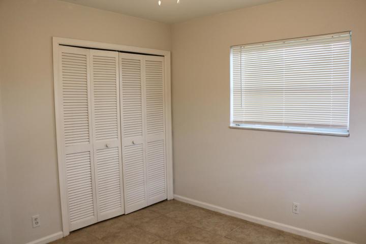 9 Burning Tree Lane Boca Raton, FL 33431 - Photo 22 of 26 an empty room with windows