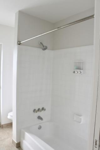 9 Burning Tree Lane Boca Raton, FL 33431 - Photo 26 of 26 a bathroom with a bathtub and a shower