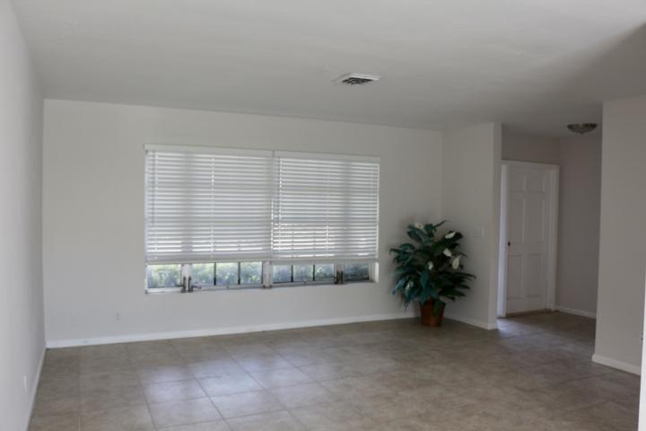 9 Burning Tree Lane Boca Raton, FL 33431 - Photo 7 of 26 a view of an empty room with a window