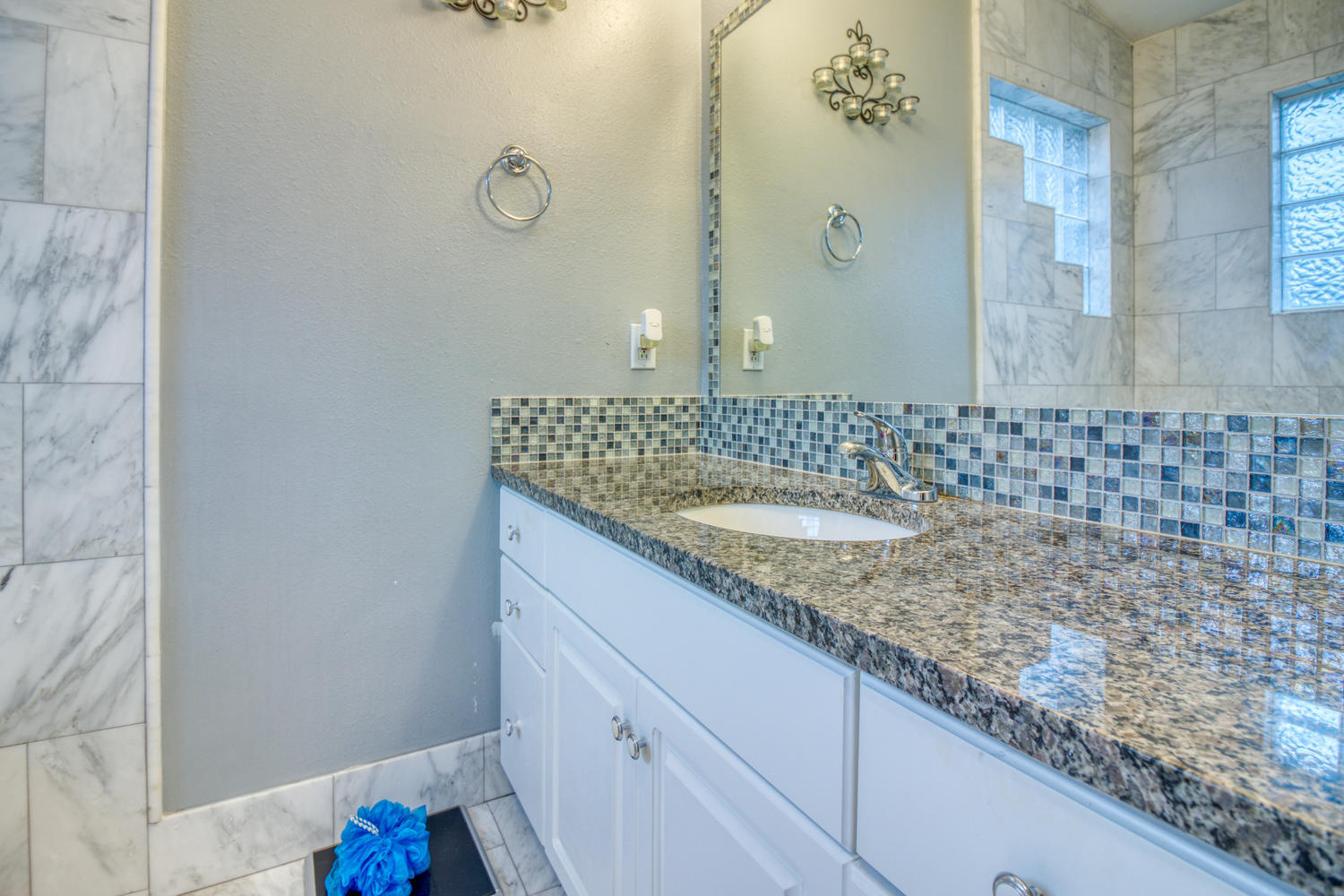 137 Pritchard Road Miramar Beach, FL 32550 - Photo 18 of 25 a bathroom with a granite countertop sink a mirror and shower