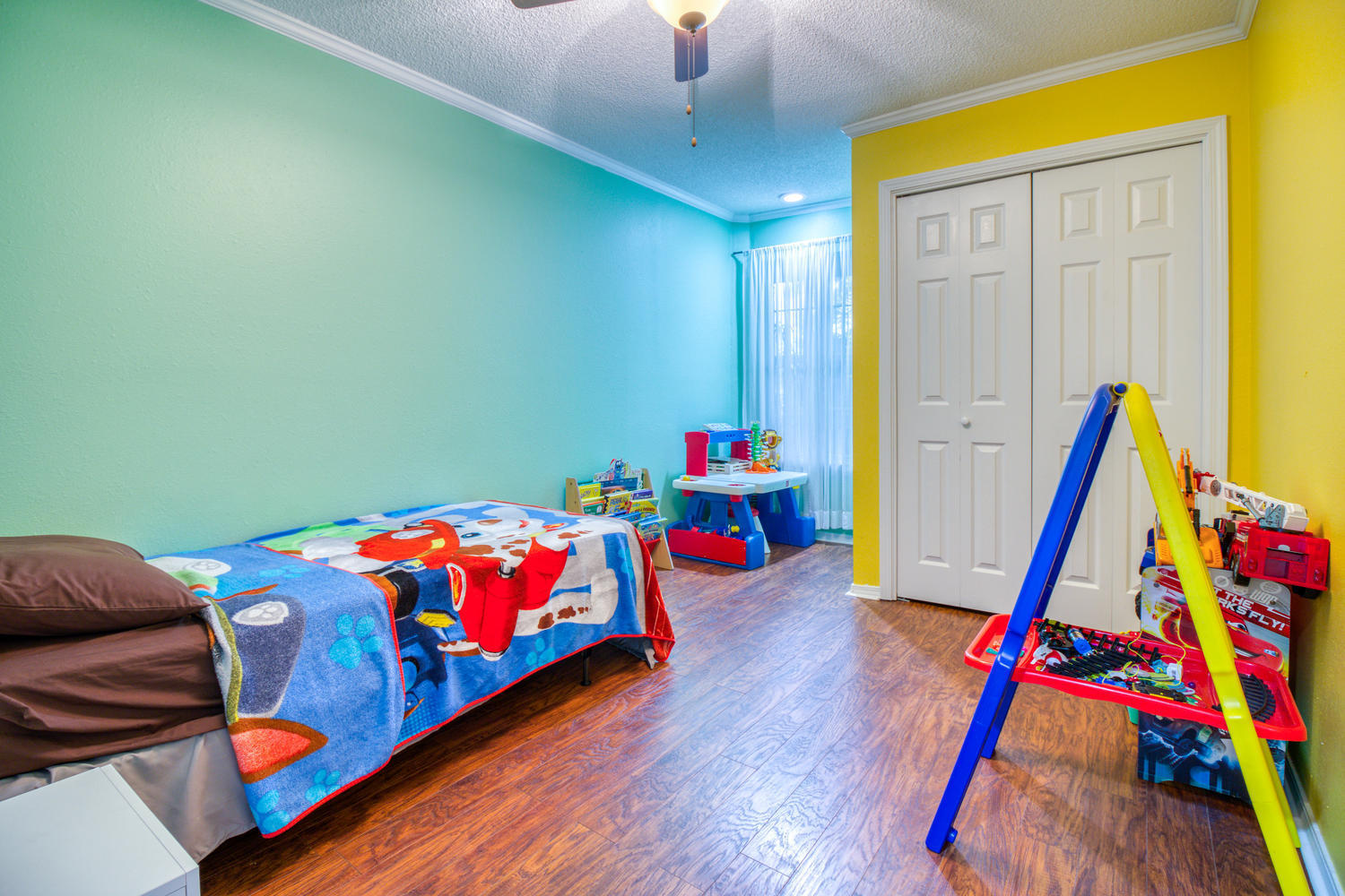 137 Pritchard Road Miramar Beach, FL 32550 - Photo 21 of 25 a kids room with a bed and toys