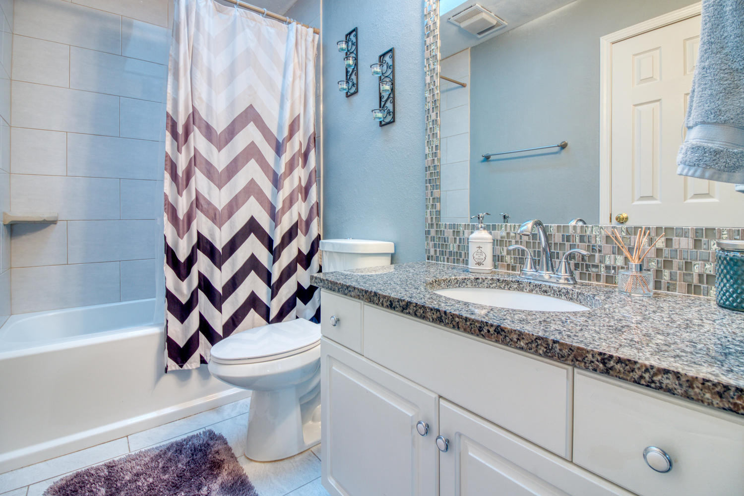 137 Pritchard Road Miramar Beach, FL 32550 - Photo 24 of 25 a bathroom with a granite countertop sink a toilet and a bathtub