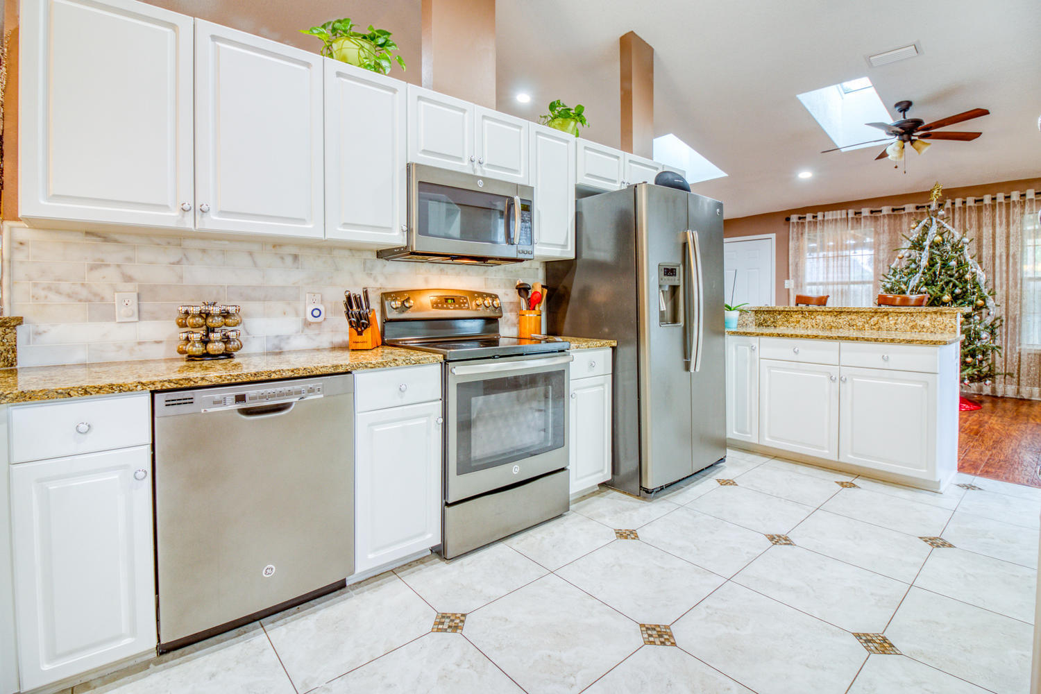 137 Pritchard Road Miramar Beach, FL 32550 - Photo 4 of 25 a kitchen with a stove a sink and a refrigerator