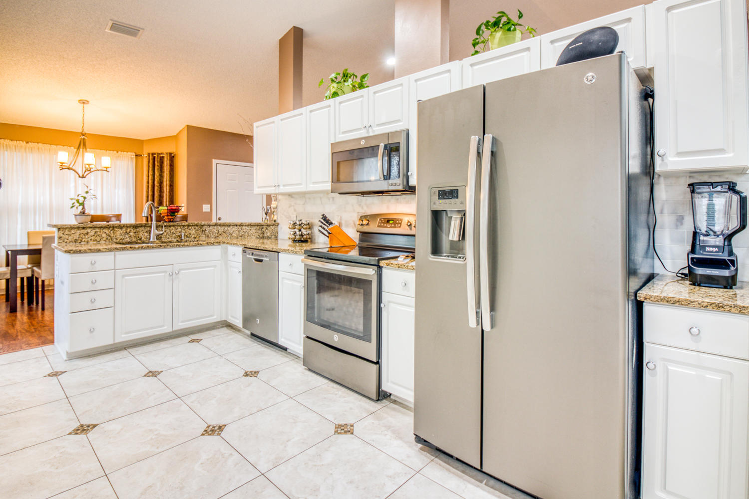 137 Pritchard Road Miramar Beach, FL 32550 - Photo 5 of 25 a kitchen with stainless steel appliances a refrigerator sink and cabinets
