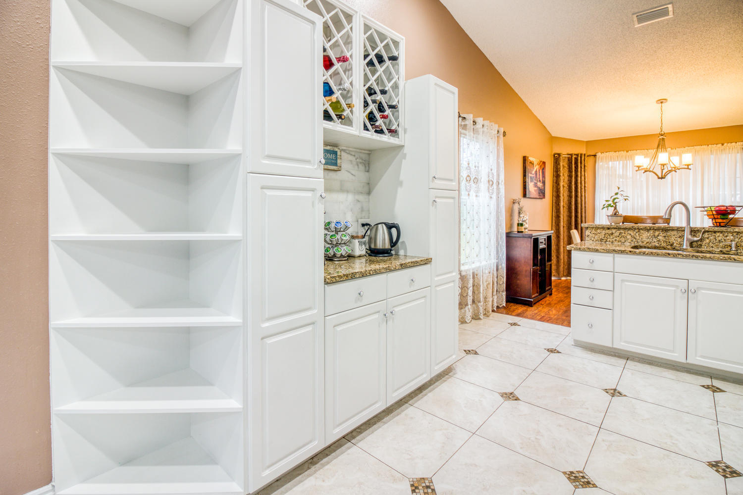 137 Pritchard Road Miramar Beach, FL 32550 - Photo 6 of 25 a kitchen with white cabinets and appliances