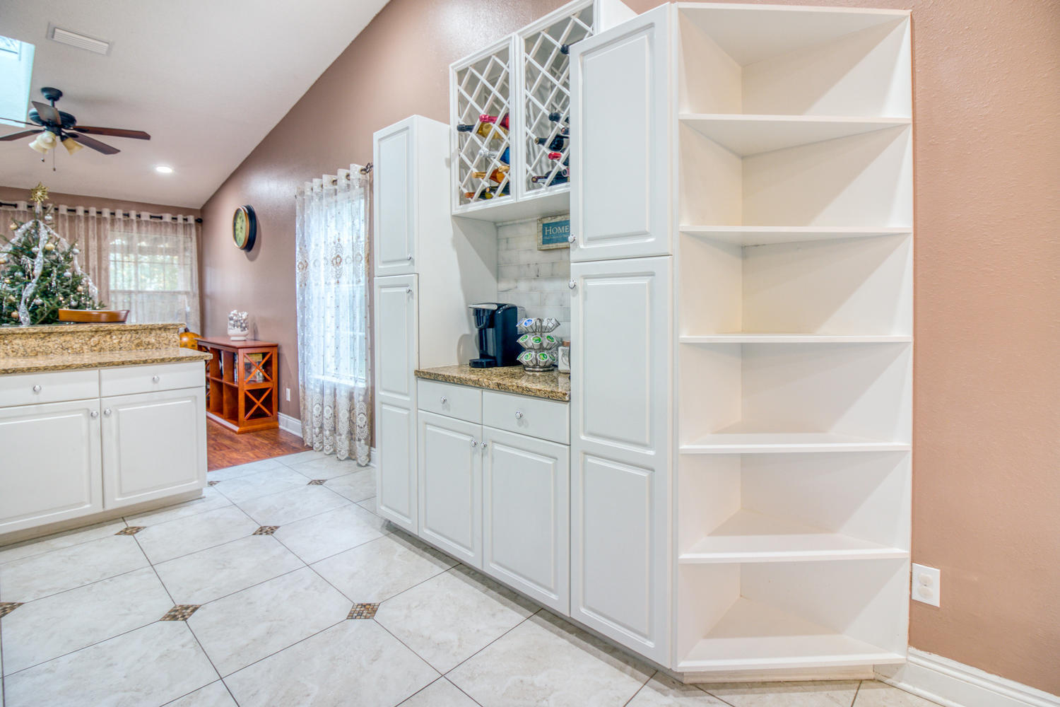 137 Pritchard Road Miramar Beach, FL 32550 - Photo 7 of 25 a kitchen with white cabinets and window