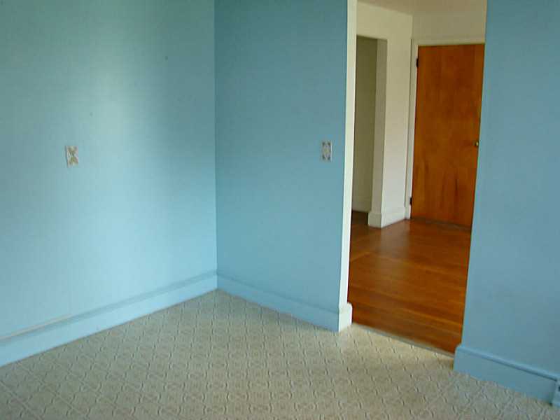 121 Ruggles Avenue Newport, RI 02840 - Photo 13 of 25 Kitchen. Room for table in the kitchen. Door is to the dining room.