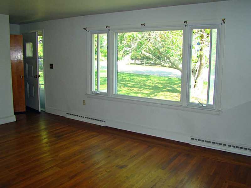 121 Ruggles Avenue Newport, RI 02840 - Photo 4 of 25 Living Room. Large picture window overlooks Front yard.