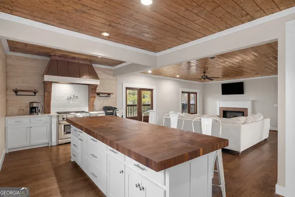 a view of a dining room with furniture wooden floor and chandelier