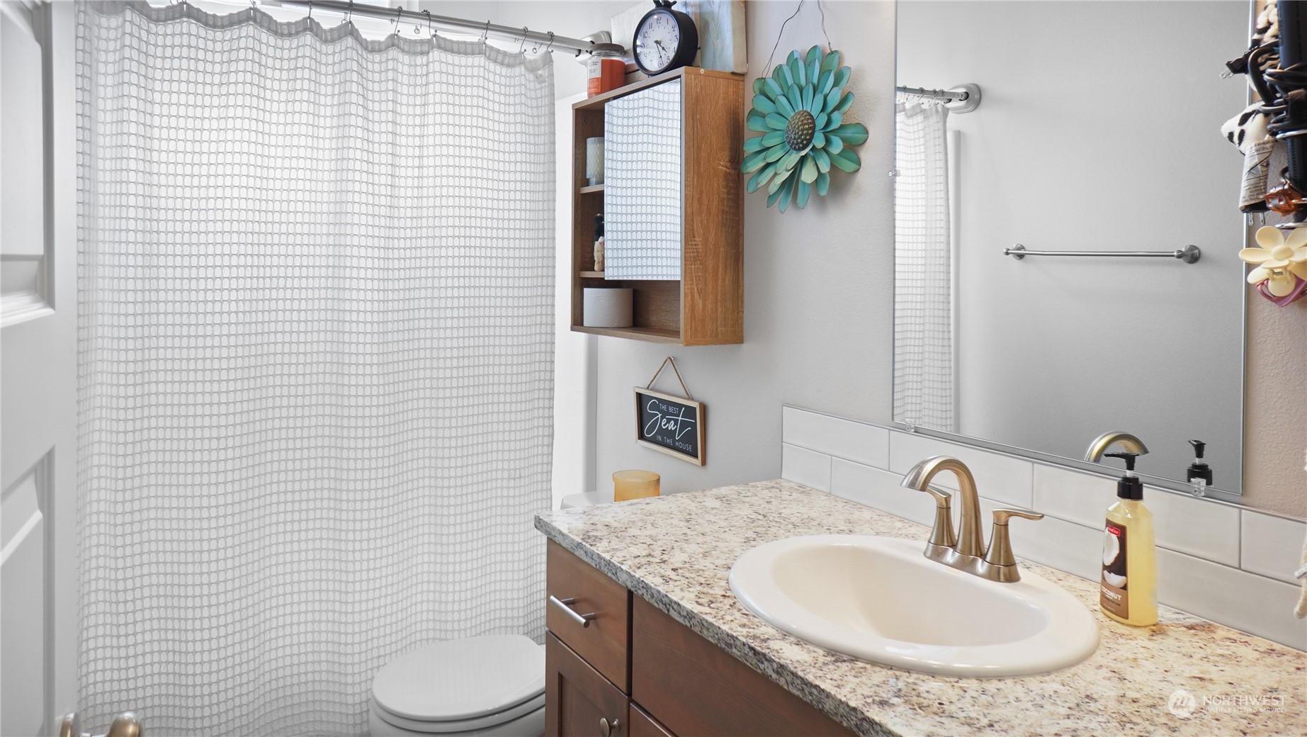 1300 E Mount Othello, WA 99344 - Photo 12 of 36 a bathroom with a granite countertop sink toilet and mirror