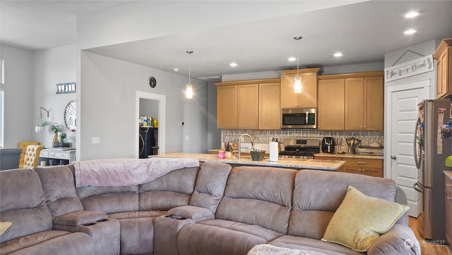 1300 E Mount Othello, WA 99344 - Photo 15 of 36 a living room with a couch and a view of kitchen