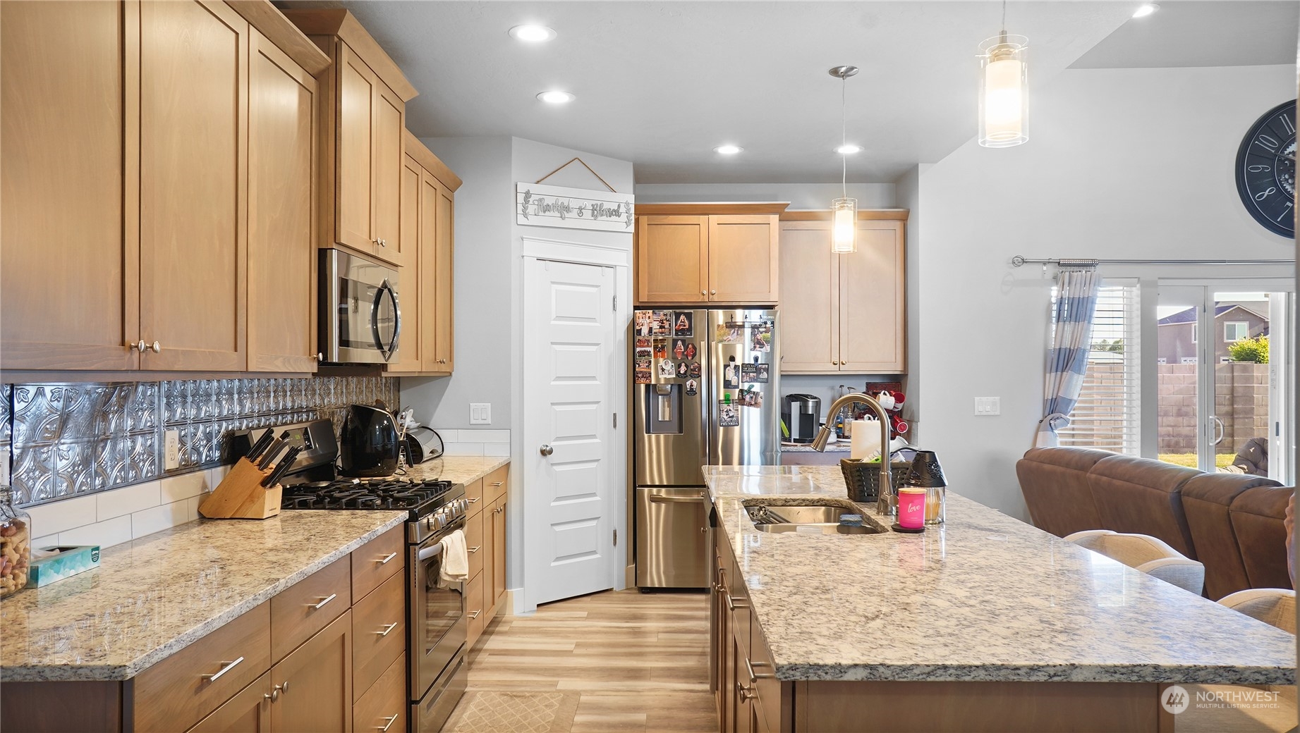 1300 E Mount Othello, WA 99344 - Photo 16 of 36 a kitchen with granite countertop a sink a counter top space stainless steel appliances and cabinets