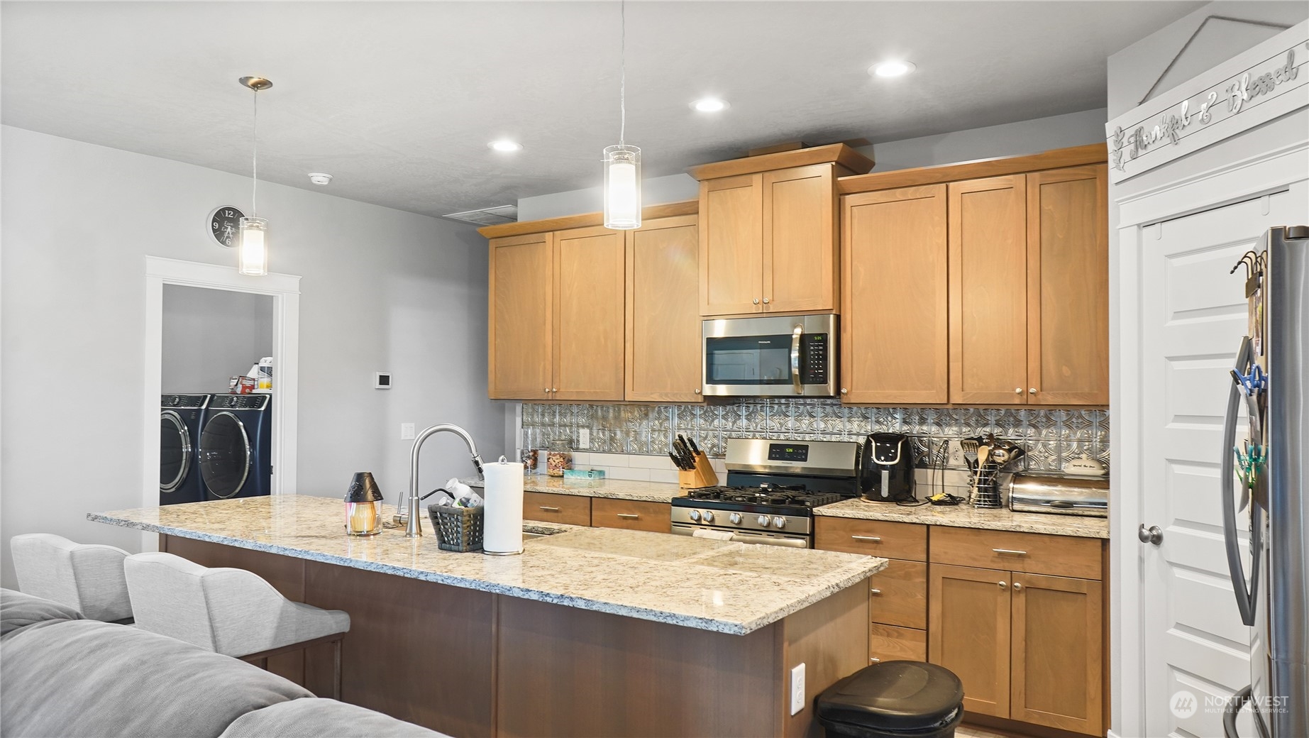 1300 E Mount Othello, WA 99344 - Photo 17 of 36 a kitchen with stainless steel appliances granite countertop a sink refrigerator and cabinets