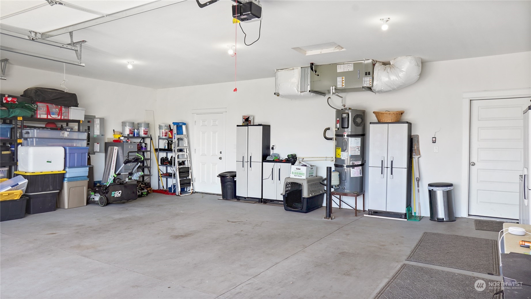 1300 E Mount Othello, WA 99344 - Photo 22 of 36 a view of a garage with furniture and a refrigerator
