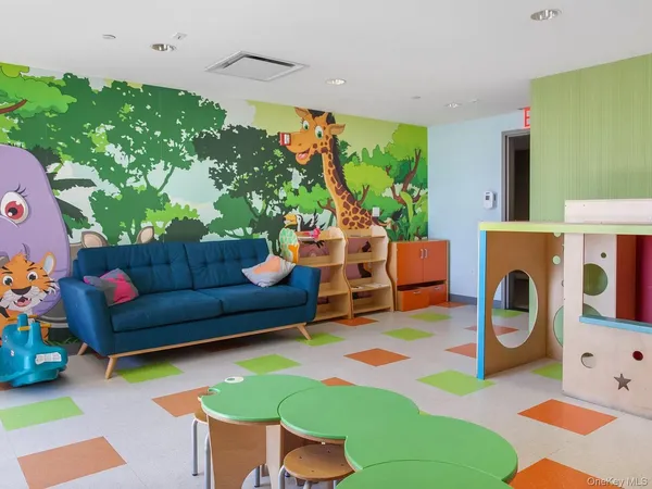 a living room with furniture and a table
