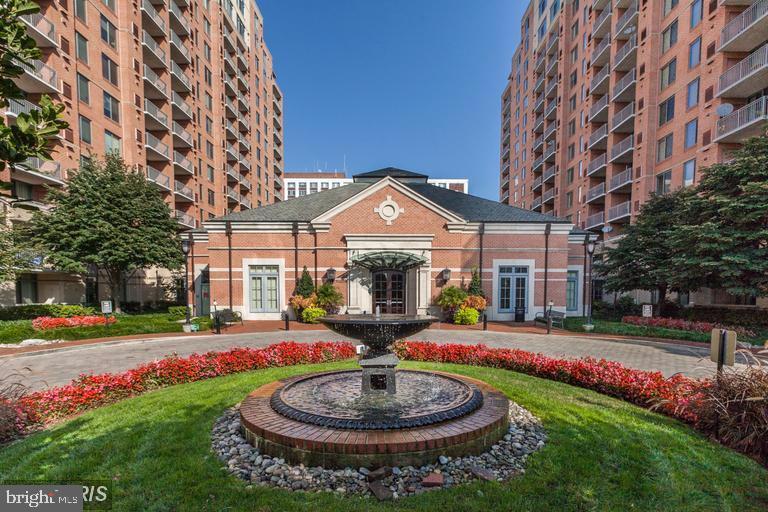 11710 Old Georgetown Road, Unit 1330 North Bethesda, MD 20852 - Photo 1 of 29 a front view of a building with garden and trees