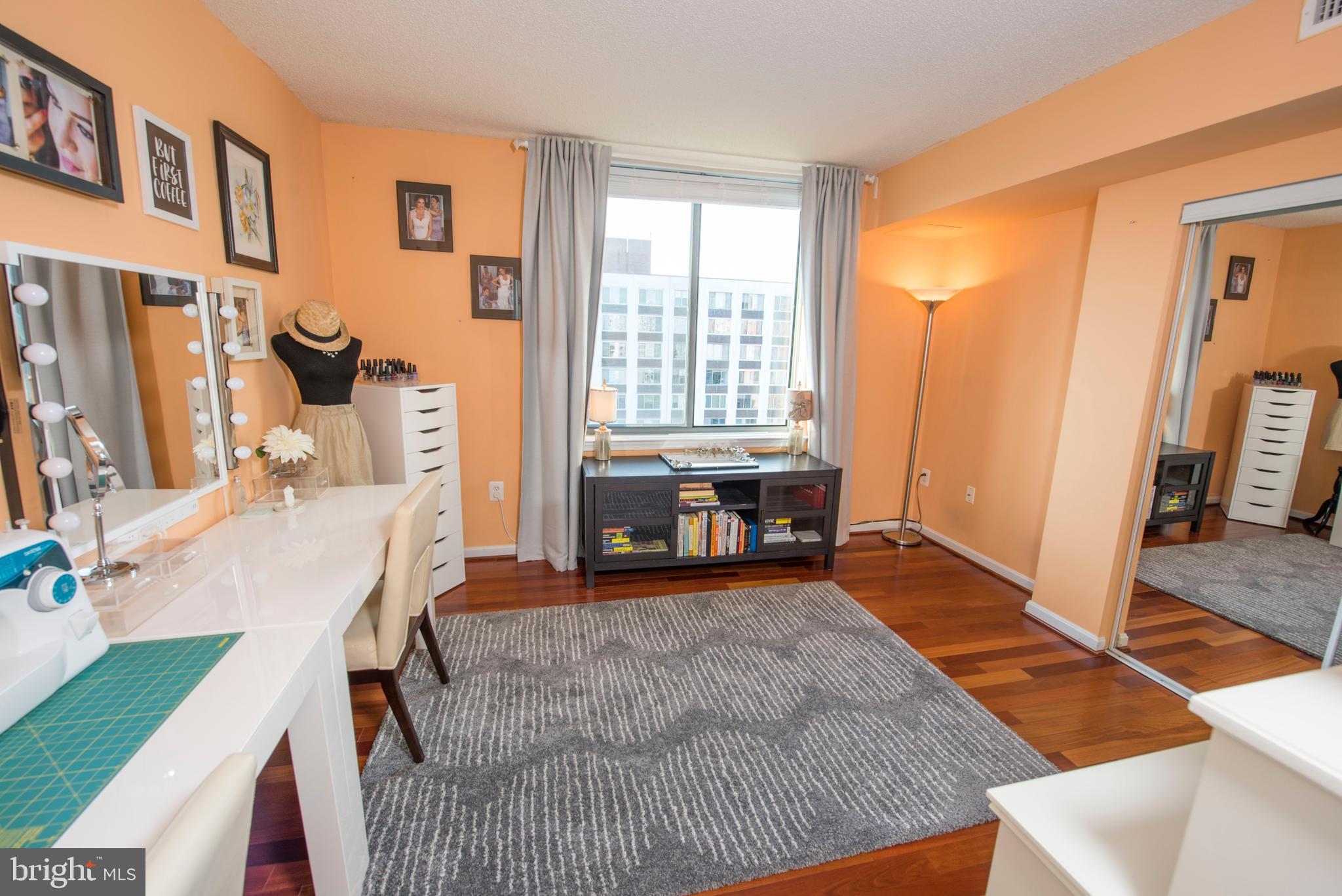 11710 Old Georgetown Road, Unit 1330 North Bethesda, MD 20852 - Photo 11 of 29 a bed room with a bed and a chair