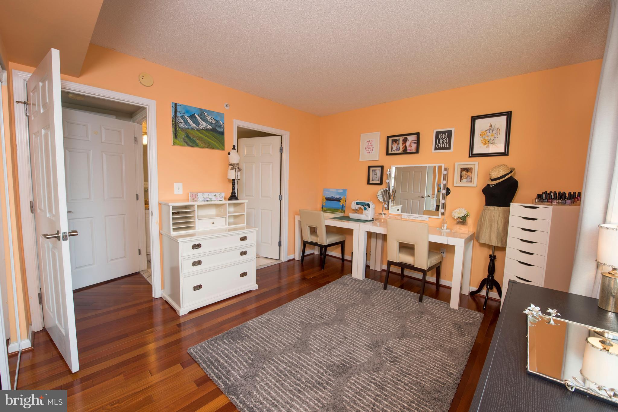 11710 Old Georgetown Road, Unit 1330 North Bethesda, MD 20852 - Photo 12 of 29 a living room with furniture and a flat screen tv