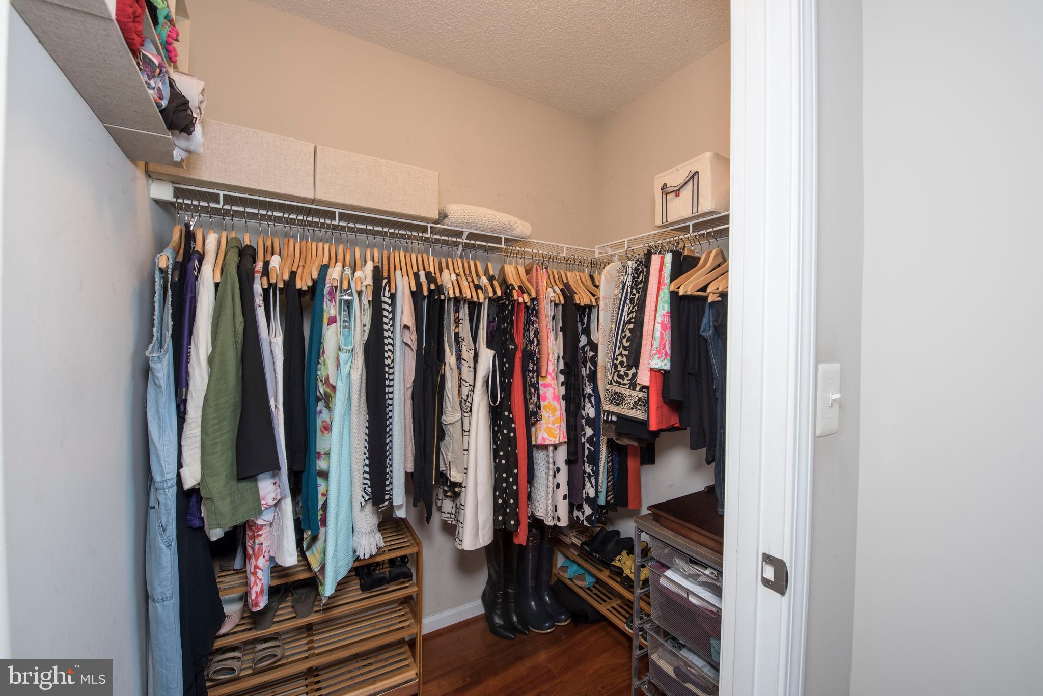 11710 Old Georgetown Road, Unit 1330 North Bethesda, MD 20852 - Photo 16 of 29 a view of walk in closet with clothes