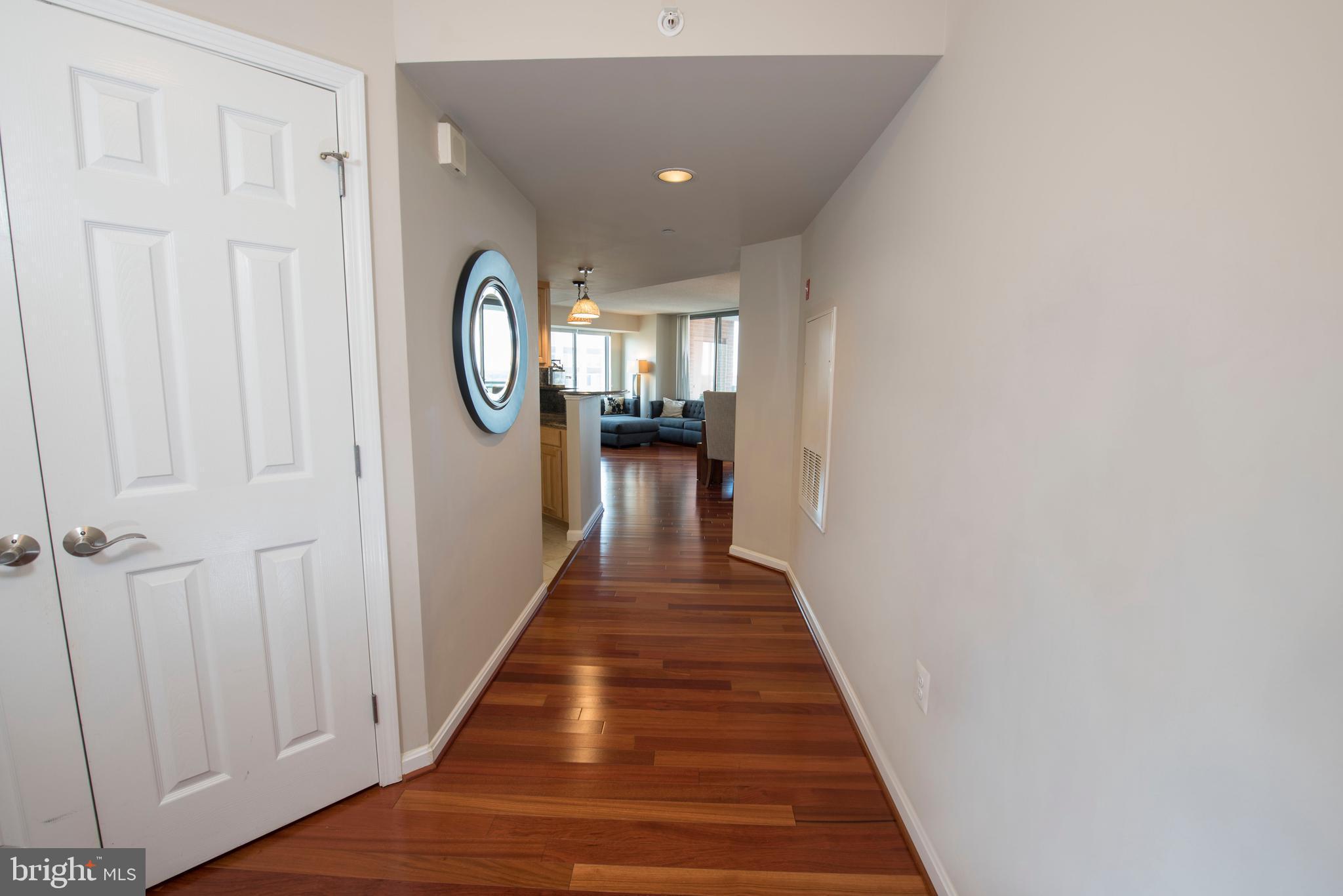 11710 Old Georgetown Road, Unit 1330 North Bethesda, MD 20852 - Photo 3 of 29 a view of a hallway with wooden floor