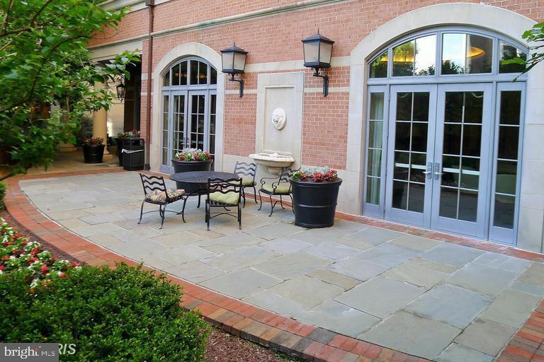 11710 Old Georgetown Road, Unit 1330 North Bethesda, MD 20852 - Photo 23 of 29 a front view of a house with a garden