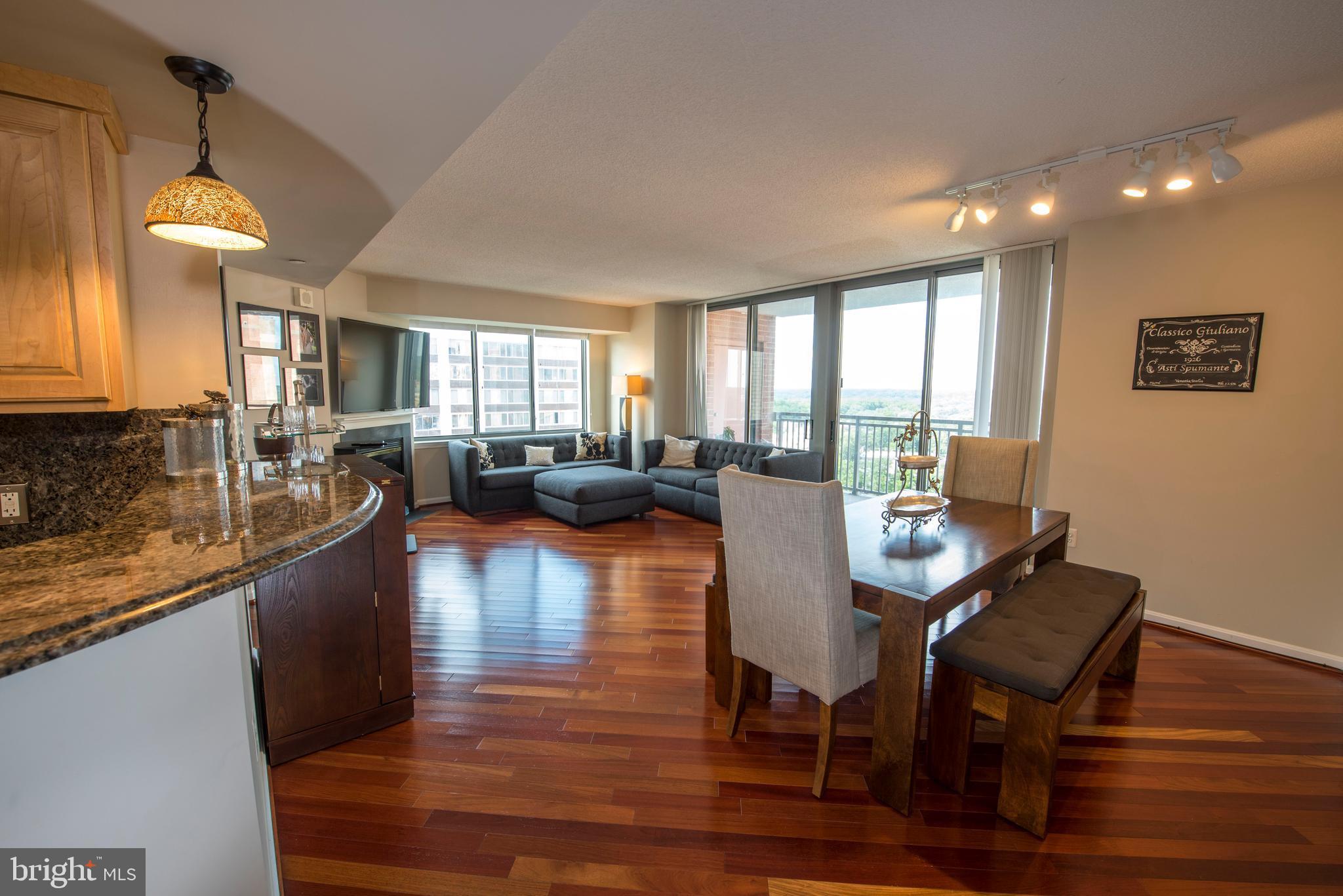 11710 Old Georgetown Road, Unit 1330 North Bethesda, MD 20852 - Photo 6 of 29 a view of a dining room with furniture window and wooden floor