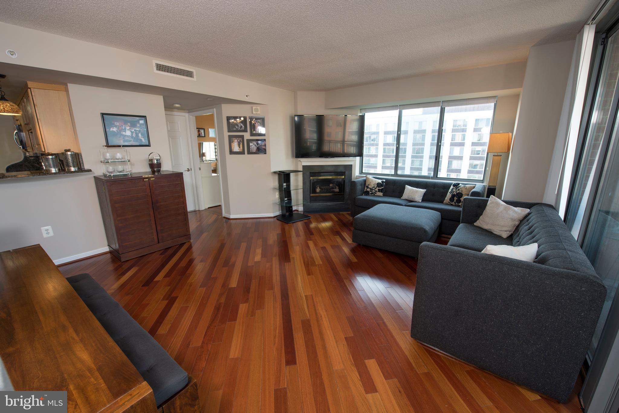 11710 Old Georgetown Road, Unit 1330 North Bethesda, MD 20852 - Photo 9 of 29 a living room with furniture and a flat screen tv