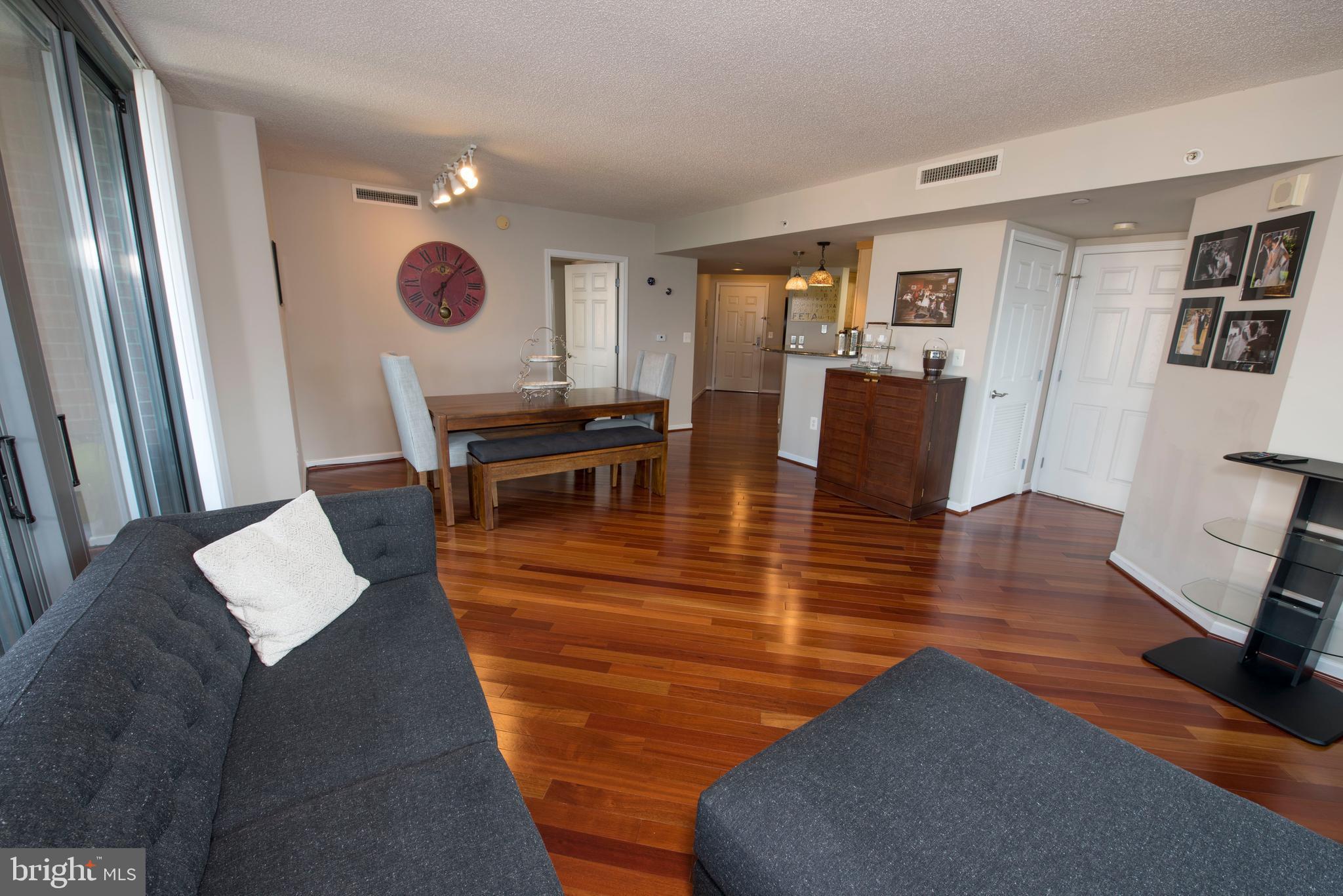 11710 Old Georgetown Road, Unit 1330 North Bethesda, MD 20852 - Photo 10 of 29 a living room with dining room and wooden floor