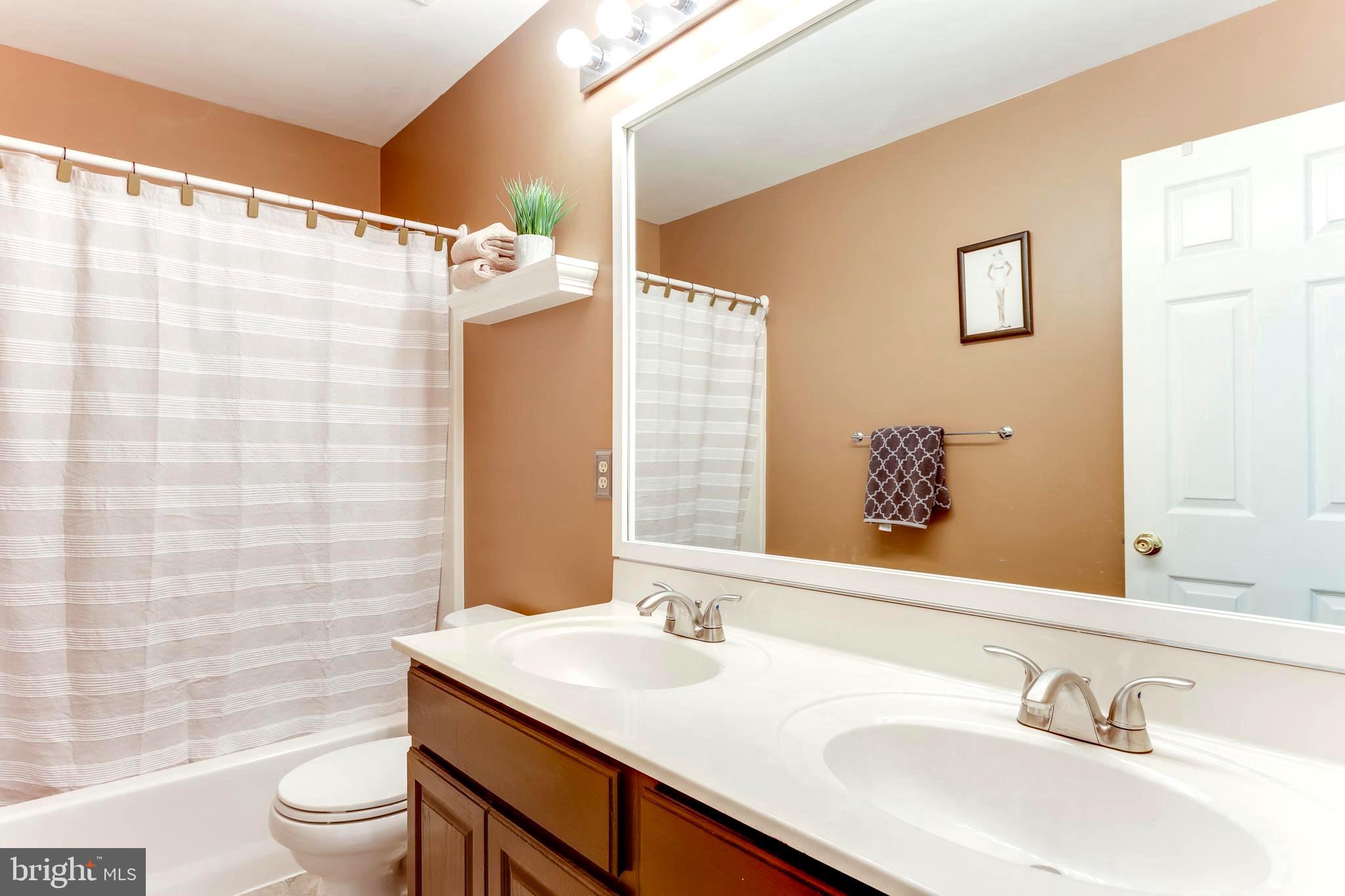 1559 Comanche Road Arnold, MD 21012 - Photo 35 of 44 Upper Level Hallway Full Bath with Dual Vanity