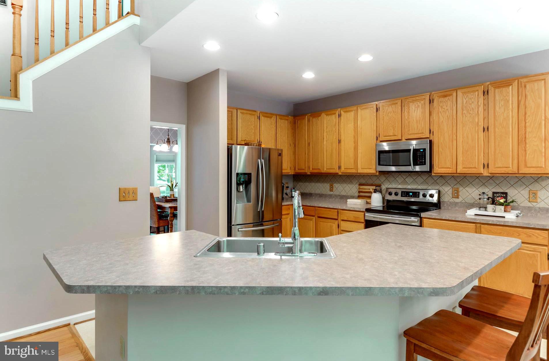 1559 Comanche Road Arnold, MD 21012 - Photo 6 of 44 Urban Chef's Kitchen with Island Dining Bar