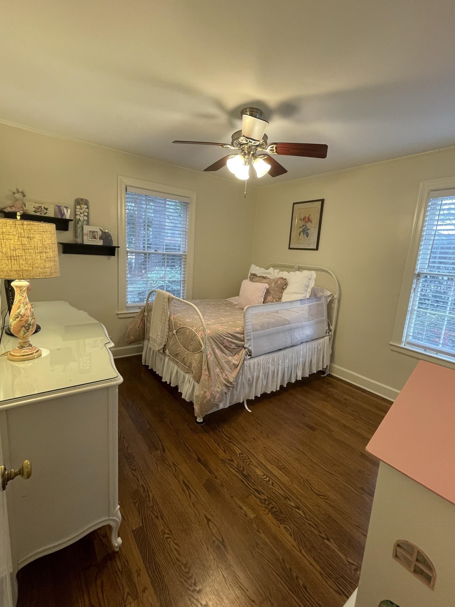 434 Colonial Road Memphis, TN 38117 - Photo 12 of 23 a bedroom with a bed and a chandelier