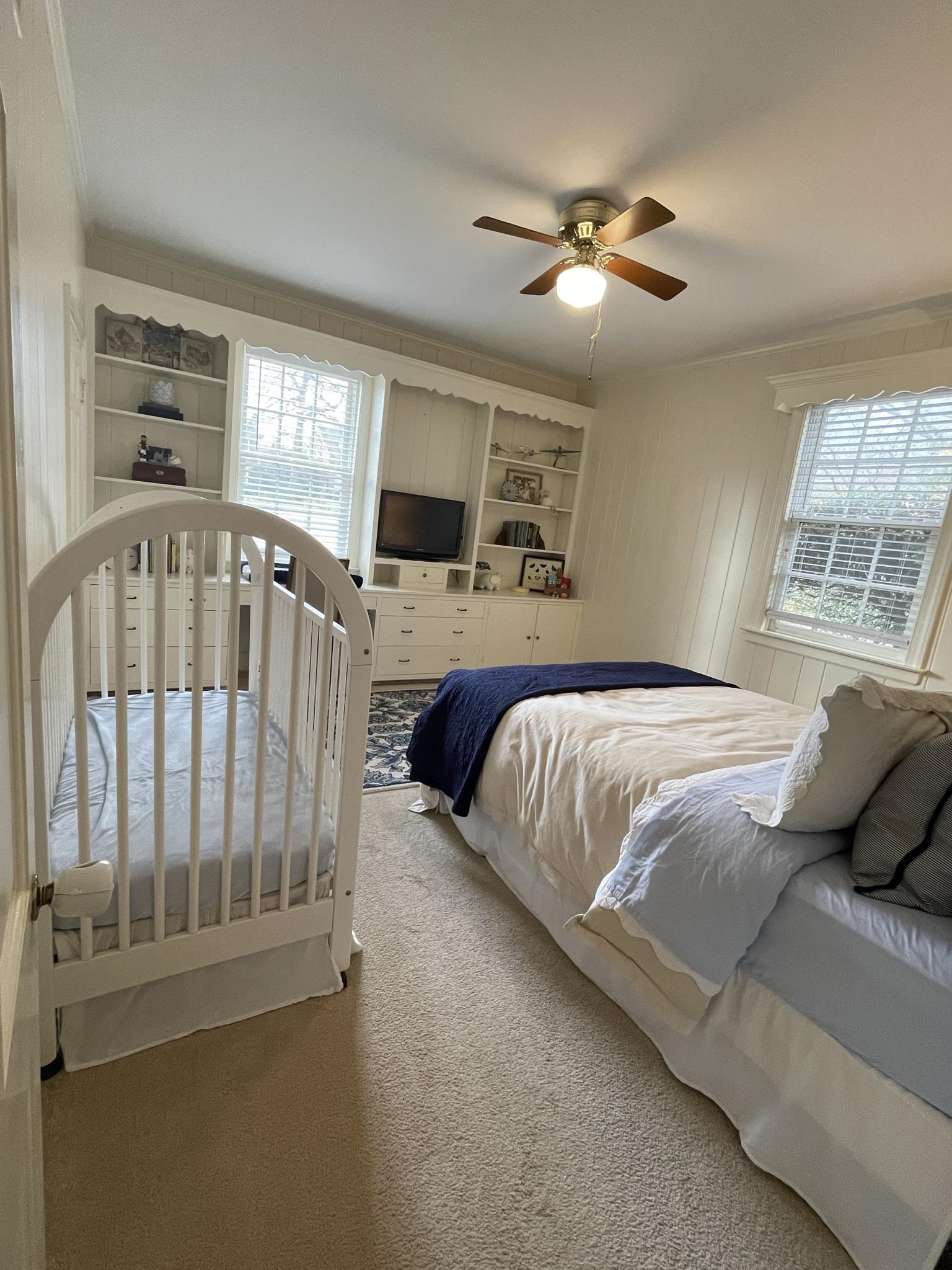 434 Colonial Road Memphis, TN 38117 - Photo 15 of 23 a bedroom with a large bed and a tv