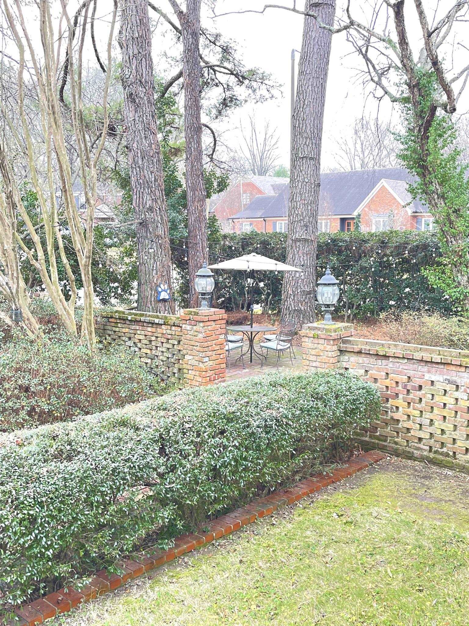 434 Colonial Road Memphis, TN 38117 - Photo 4 of 23 a view of a garden with a bench