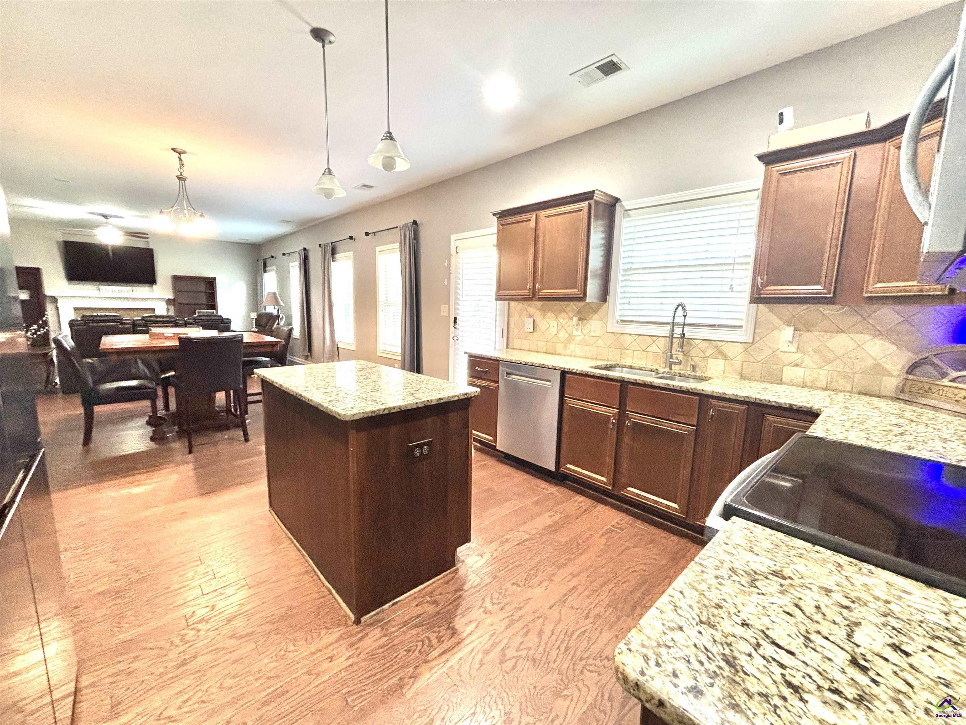 600 Post Oak Way Warner Robins, GA 31088 - Photo 21 of 50 a large kitchen with a large counter top space appliances and cabinets
