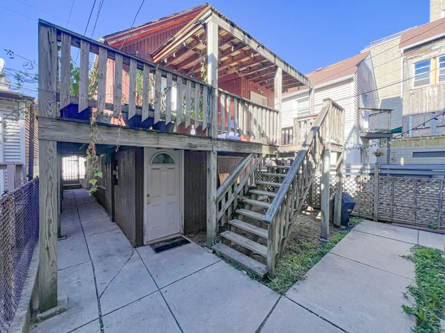 a living room with furniture a dining table and a window