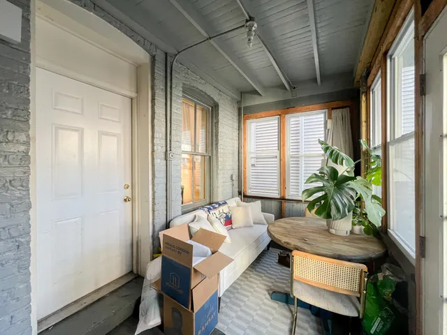 a living room with furniture and a window