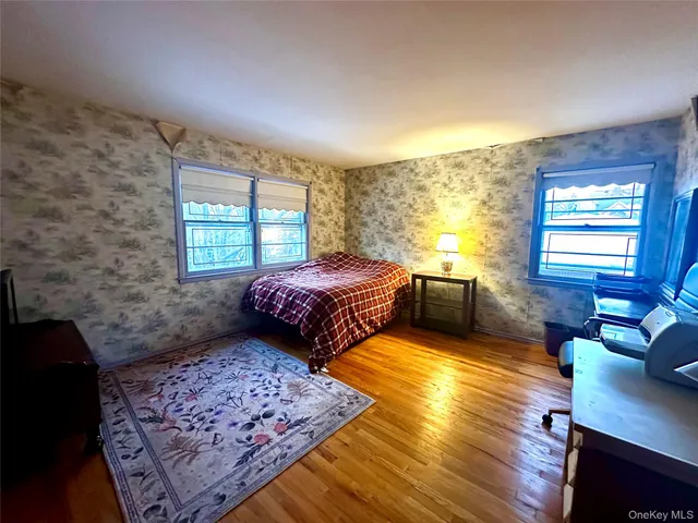 a room with furniture pool table and windows