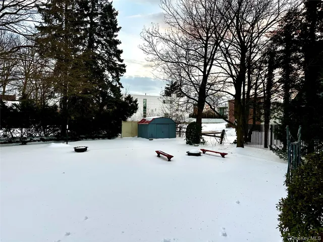 a picture of a bench in front of a wall