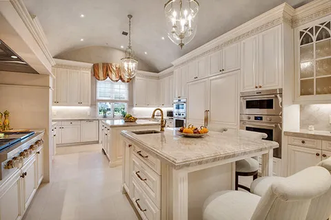 a view of a dining room with furniture and a chandelier