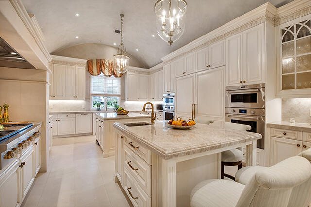 17791 Saxony Court Boca Raton, FL 33496 - Photo 8 of 41 a kitchen with a sink a stove a refrigerator and white cabinets