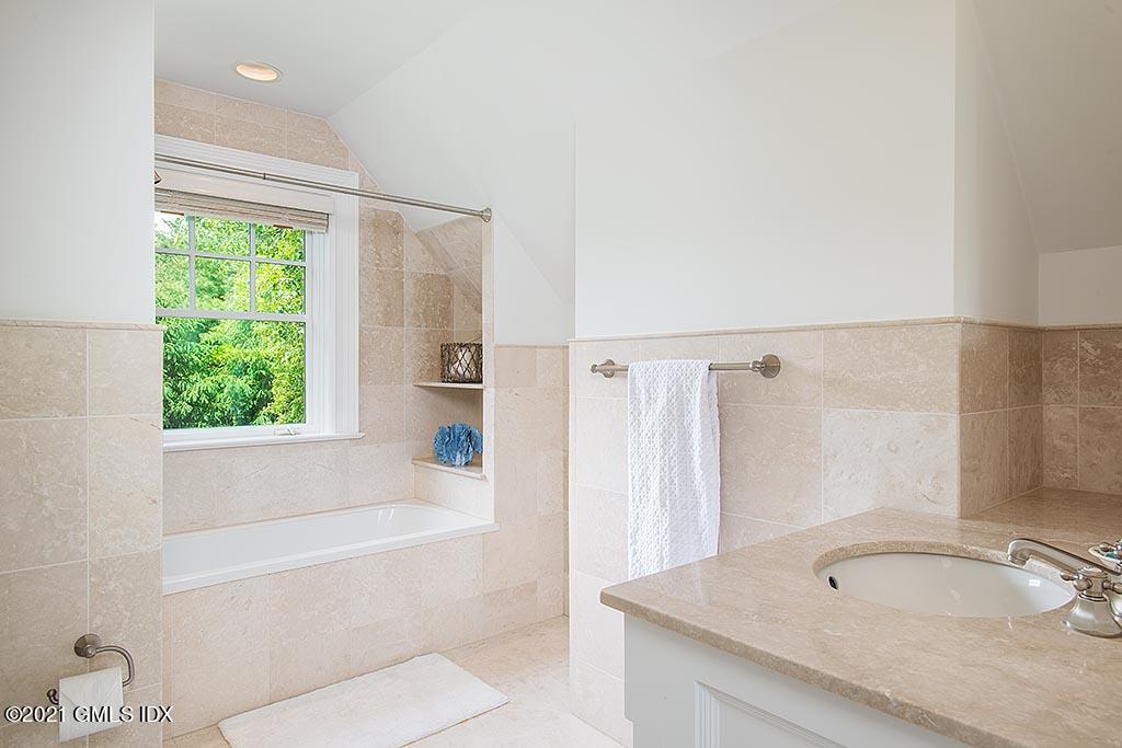 27 Leeward Lane Riverside, CT 06878 - Photo 24 of 38 a bathroom with a granite countertop sink toilet and shower