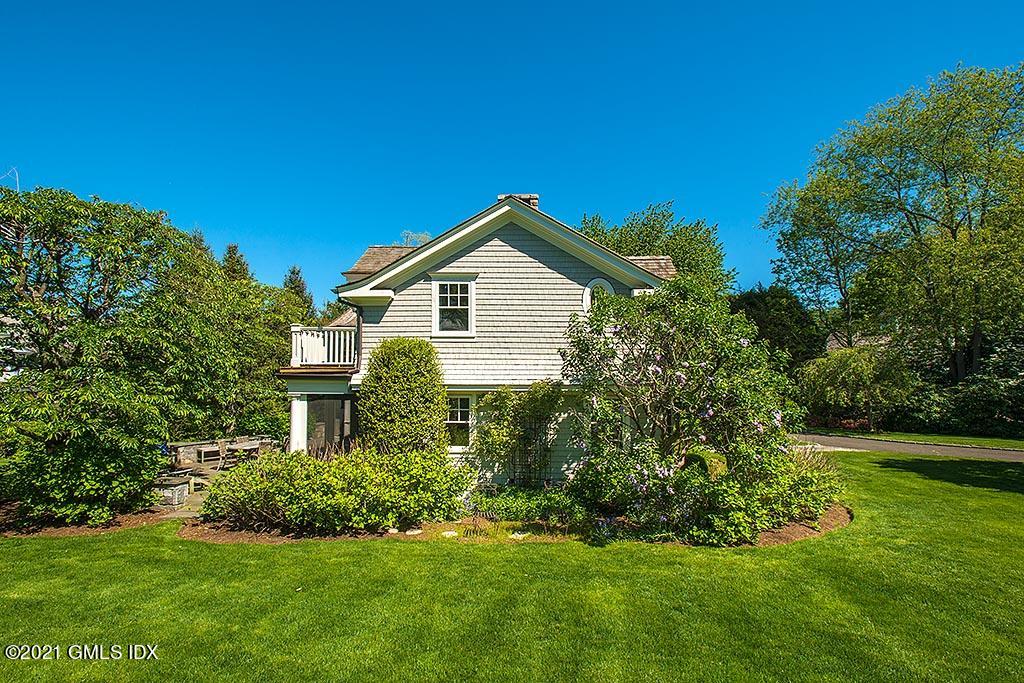 27 Leeward Lane Riverside, CT 06878 - Photo 25 of 38 a front view of a house with a yard