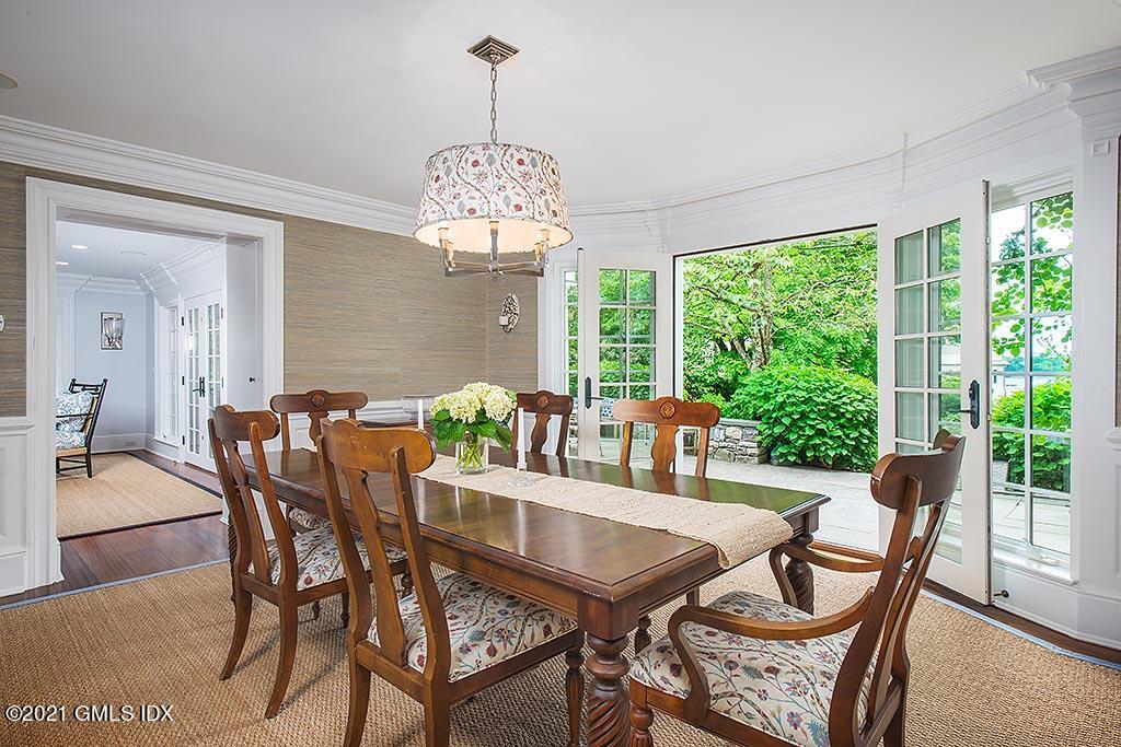 27 Leeward Lane Riverside, CT 06878 - Photo 9 of 38 a view of a dining room with furniture window and outside view